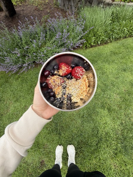 Vegan Wellness Retreats — a guest holding a fresh acai bowl